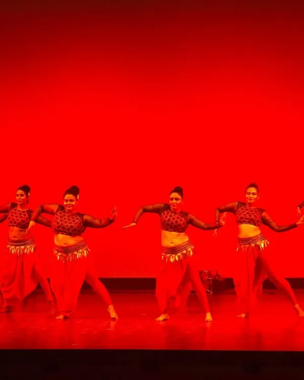 Our troupe performing "Satori" on a dramatically lit red stage. We focus on creating visually stunning formations and synchronized movements that make a powerful impact.