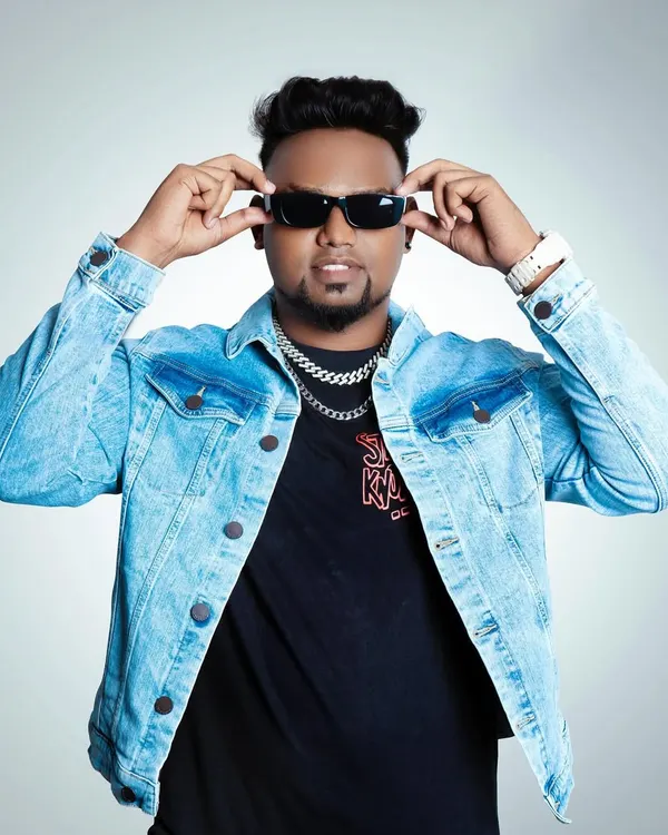 My style reflects my music. I bring a confident and authentic hip-hop persona to my work, which sets the tone for the entire event.