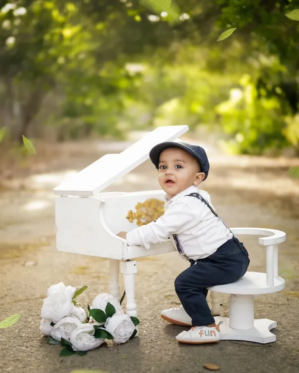A little gentleman at his piano. We bring our props to private outdoor locations in Jaipur to create these magical, storybook scenes.