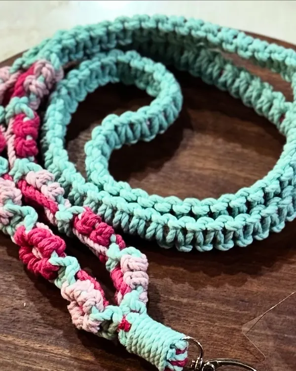 A beautiful multi-color lanyard with a floral design in mint, pink, and light pink. It's a fun and stylish way to carry your phone.
