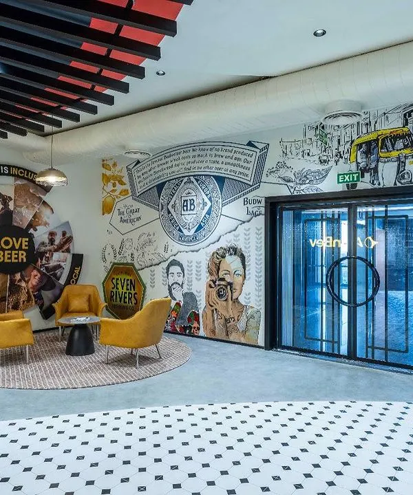 The reception mural at the AbInbev corporate office is the first thing visitors see. Spanning 60 feet, this piece was designed to tell the story of their brands in India, featuring a collage of imagery from an auto-rickshaw to local faces, all united by a love for beer.