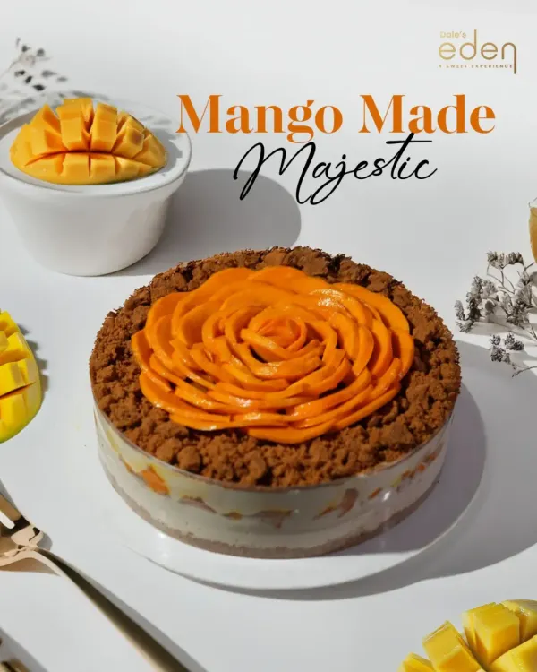 Mango made majestic. This dessert features a beautiful mango rose made from fresh Alphonso slices, sitting atop a creamy base with a crunchy crumble. It's a dream for any mango lover.