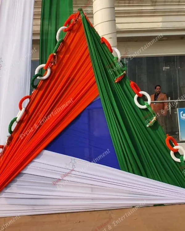This triangular fabric installation in saffron, white, and green is a bold and artistic way to decorate an outdoor area for Independence Day. It's a modern take on patriotic decor.