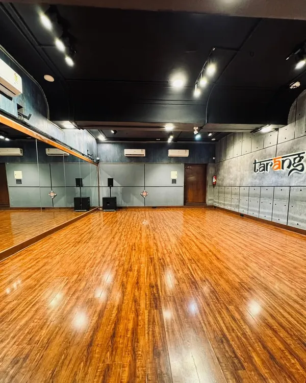 A full view of our main studio floor. The wide, open space with professional wooden flooring is perfect for group activities, allowing plenty of room for movement during dance workshops or for participants to lay down comfortably during meditation sessions.