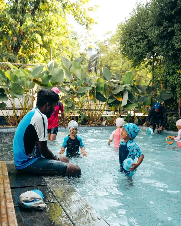 Play is the best way to learn. A coach engages with toddlers in our shallow pool, using games and gentle encouragement to build water confidence and develop motor skills.