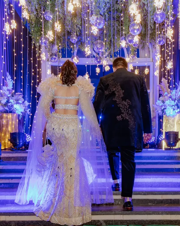 Making a grand entrance. I captured Sahas and Rozy from behind as they walked up the stairs to their sangeet, the dramatic lighting and their stunning outfits creating a truly cinematic moment.
