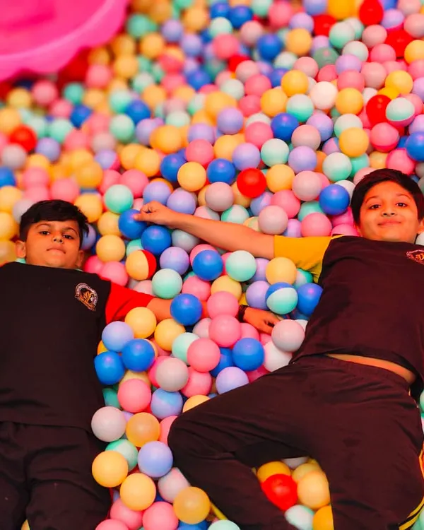 Just chilling in a sea of color. Our massive ball pit is a favorite spot for kids to relax, play, and make new friends.