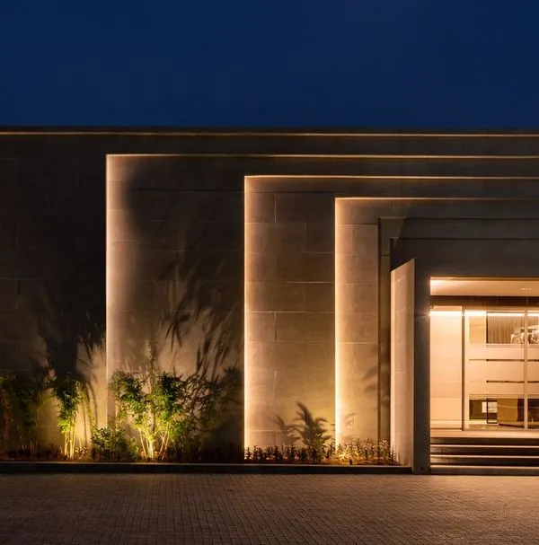 I believe a building's presence should not fade with the daylight. For this commercial sales office in Mohali, we used layers of light, combining clean linear LEDs to trace the architecture with dramatic uplighting on the textured walls and a pattern of accent lights for a stellar effect.