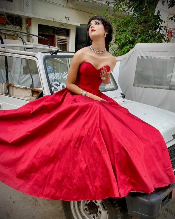 This is what I love to do: create fantasy looks for shoots. I designed and styled this custom red ball gown to create a powerful, cinematic moment. The rich fabric and classic silhouette were perfect for this outdoor concept shoot.