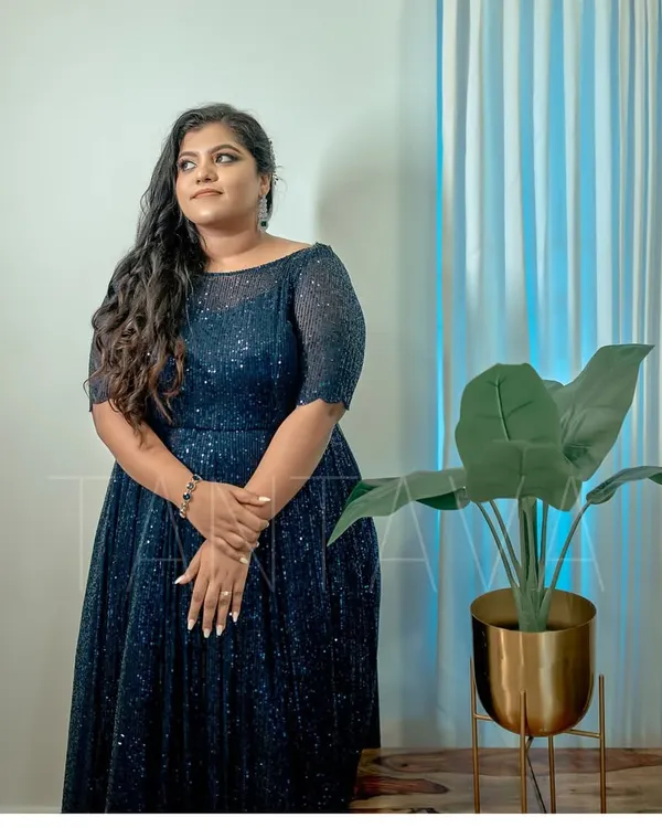 Our gorgeous bride Sincy in a classy navy blue sequins gown for her cocktail night. The boat neck and fitted sleeves create a sophisticated and elegant silhouette.