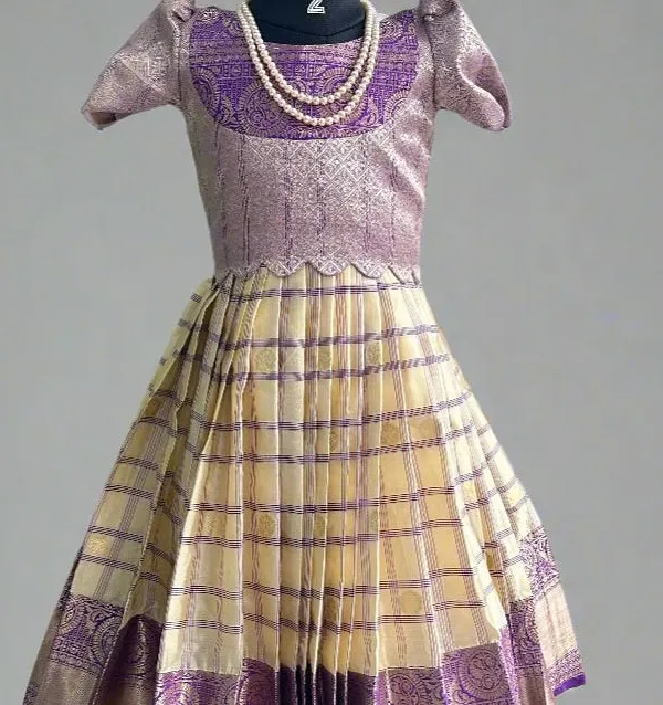 A beautiful example of our kids' wear collection. This traditional lehenga is custom-stitched from one of our popular semi-Kanchi sarees, creating a timeless look for your little one.
