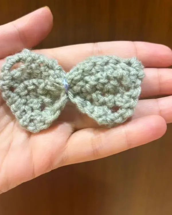 Look at this adorable little bow made by one of my students. They've been practicing the stitches we learned in class, and the results are just beautiful.