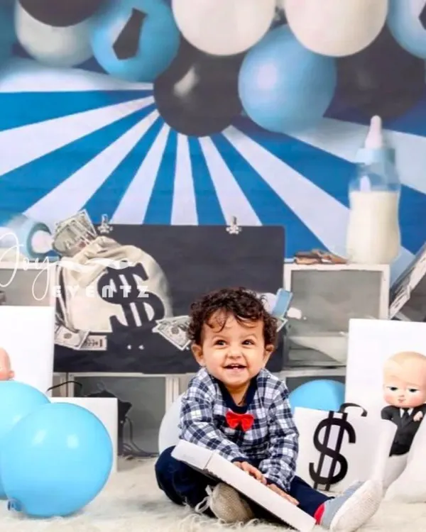 Your little one is the boss in our popular Boss Baby themed photoshoot. We provide the full setup, including a money-themed backdrop, dollar sign pillows, and a tiny briefcase, for a fun and memorable session.