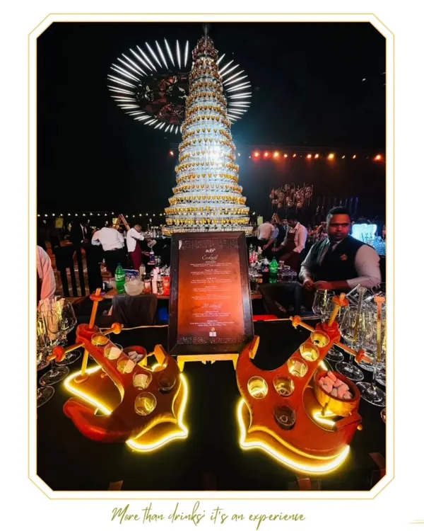 We believe the bar should be the heart of your celebration. This magnificent champagne tower is more than just a drink station; it's a grand centerpiece designed to create a spectacular, unforgettable moment for you and your guests.
