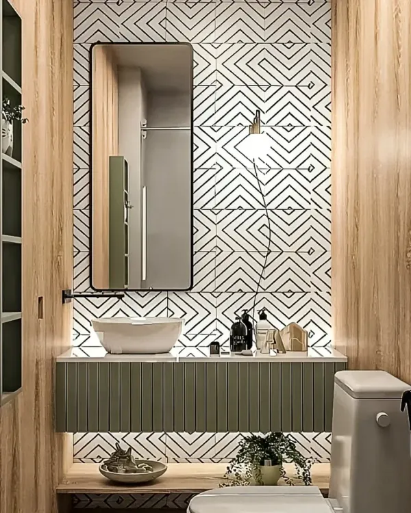 This compact bathroom combines bold geometric tiles with warm wood textures. The floating vanity and under-cabinet lighting make the room feel larger and more open.