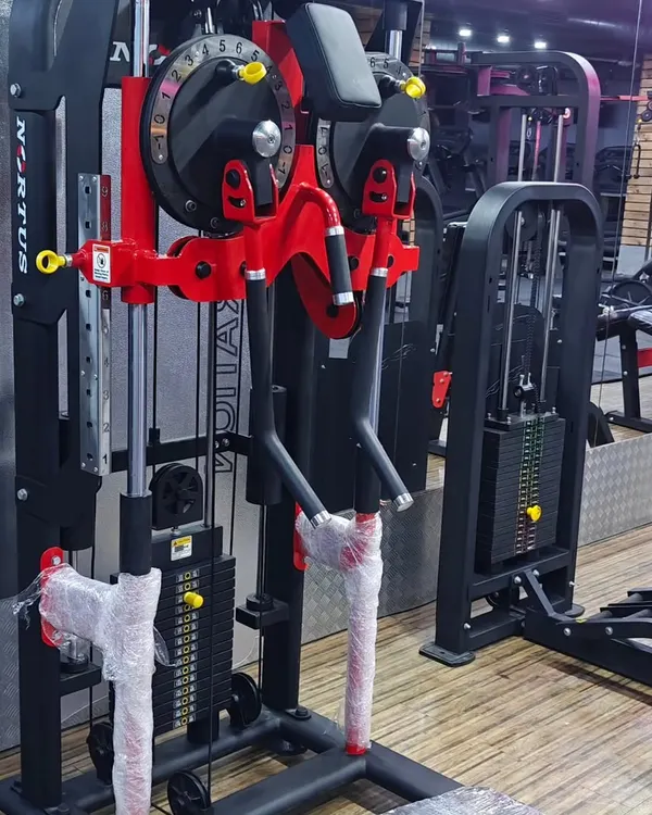 A close up of our new Multi Flight Machine, showcasing its adjustable arms and weight stack for a customized workout.