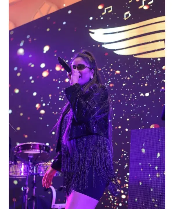 Our female vocalist, captured in her element. She brings a powerful voice and incredible stage presence to every performance, ensuring the energy levels are always at their peak.