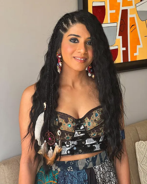 Invest in your hair, it's the crown you never take off. This bohemian-inspired look features multiple small braids and accessories for a fun, festival vibe.