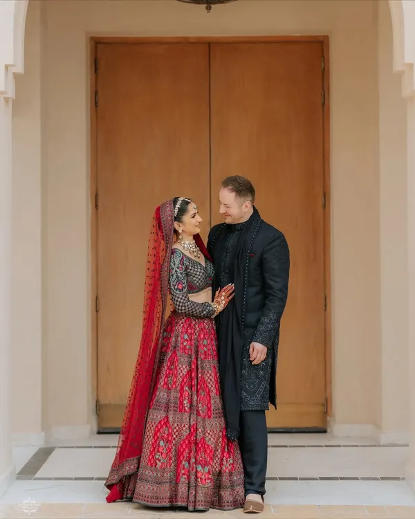 A classic, romantic portrait. I posed this couple against a simple, elegant backdrop to let their connection and stunning outfits be the focus.