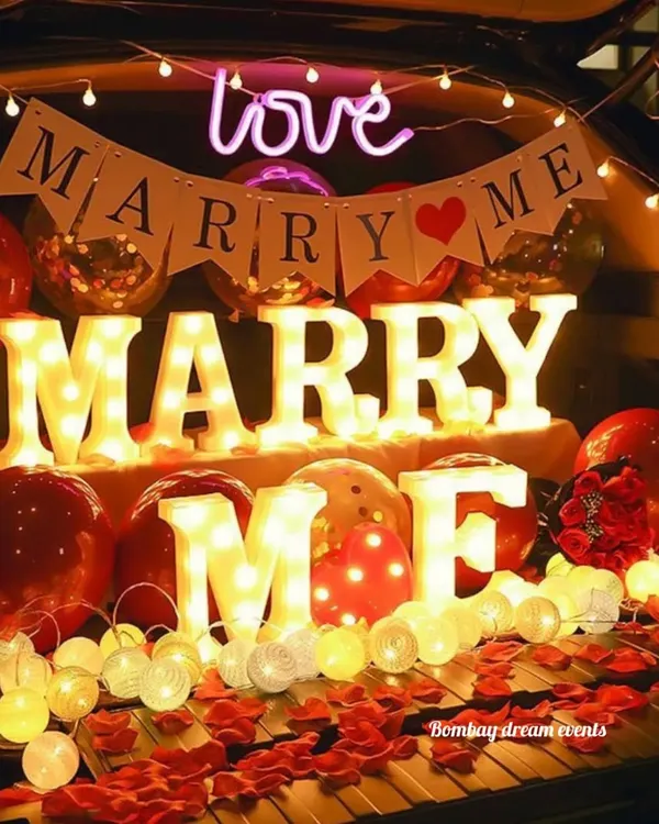 The perfect surprise proposal. This car boot decoration features 'MARRY ME' marquee letters, a neon sign, balloons, and rose petals for a truly romantic gesture.