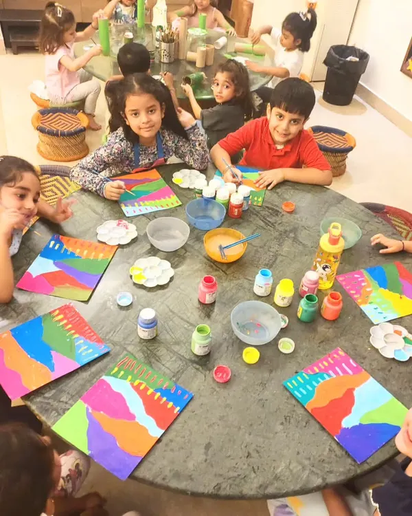I believe art is a joyful, shared experience. Here, my youngest students are learning about color and strokes, filling the studio with laughter and creativity.