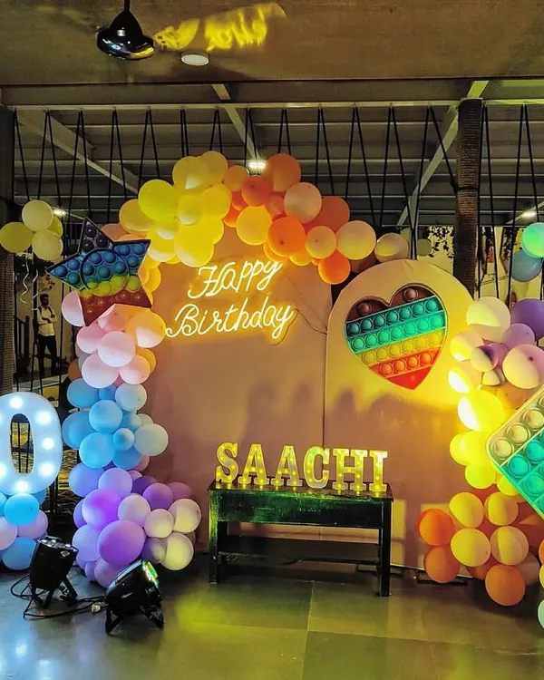 A vibrant Pop-It themed birthday party for Saachi's 10th birthday. Our team loves bringing creative and colorful party ideas to life with custom backdrops, marquee lights, and balloon arrangements.