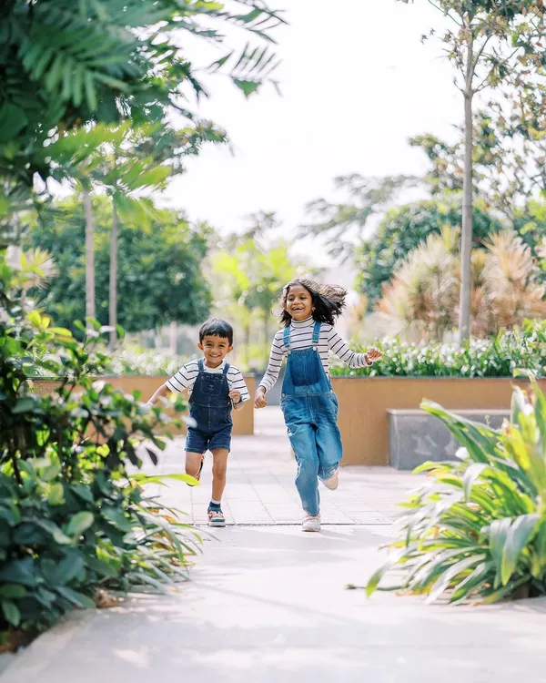Let them run. My favorite shots are often the ones in motion, capturing the pure energy and happiness of siblings playing together in a beautiful outdoor setting.