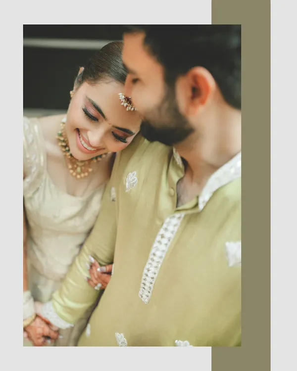 A beautifully soft and intimate portrait. The bride's serene expression as she rests her head on the groom's shoulder speaks volumes about their comfort and deep connection.