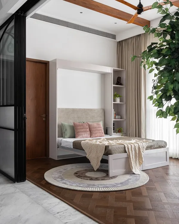 This multifunctional room is a perfect example of smart design. It serves as a cozy den by day, and transforms into a comfortable guest room at night thanks to the stylish and easy-to-use Murphy bed.