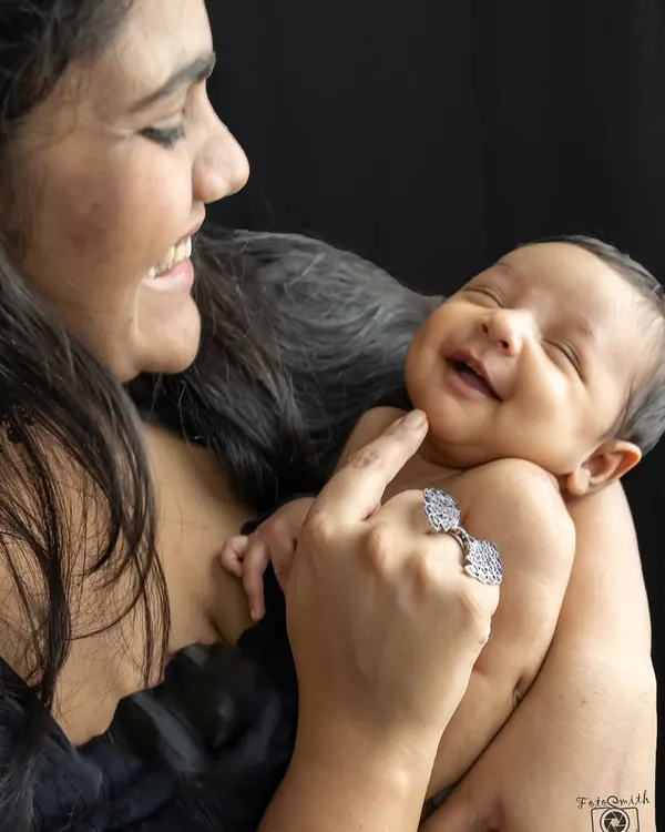 The pure joy of a mother's smile as she looks at her baby. These are the candid, love-filled moments I aim to capture in every family session.