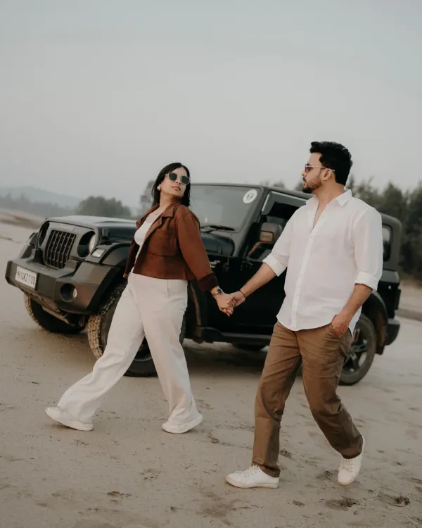 Walking hand-in-hand, leading each other on an adventure. With their Thar in the background, this shot captures the essence of a couple ready to take on the world together.