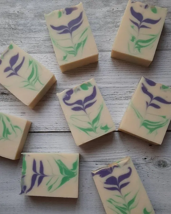 An arrangement of my Blooming Lavender soap bars, each with a unique, hand-poured floral swirl. The design ensures no two bars are exactly alike, just like flowers in a field.