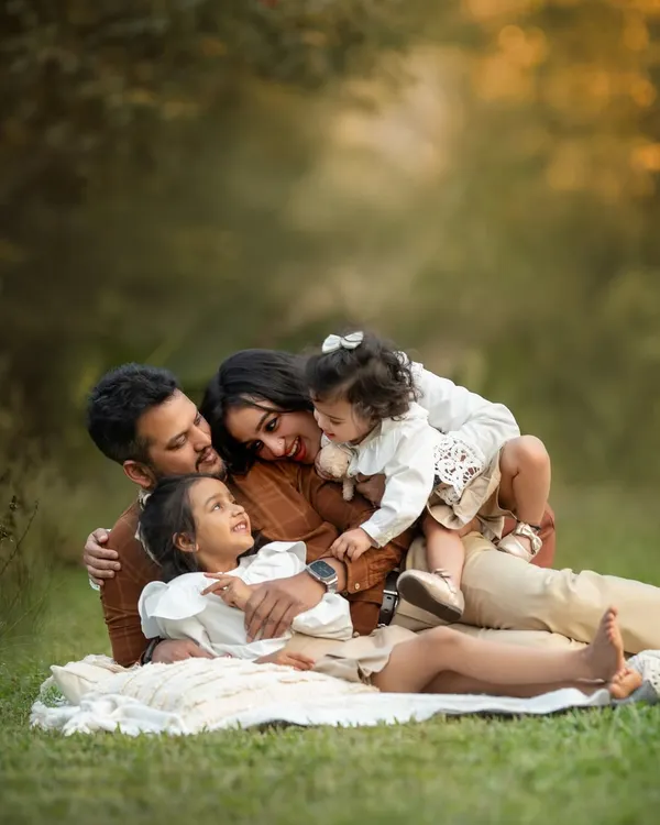 A candid moment of pure family love. I guide my families into comfortable poses and then wait for these unscripted interactions to happen. This is the heart of family milestone photography.