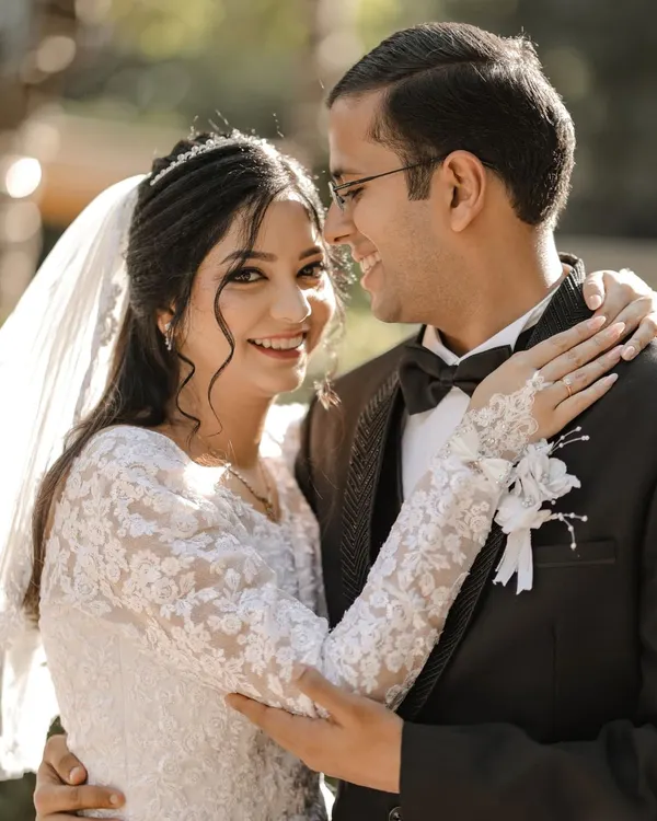 A joyful and candid portrait of the bride and groom after their church ceremony in Delhi.