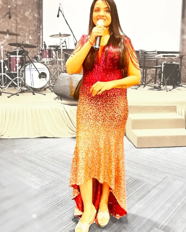 In my element under the spotlight. This look was for a musical night where I wore a sparkling red and gold gown, ready to host an evening filled with melodies and memories.
