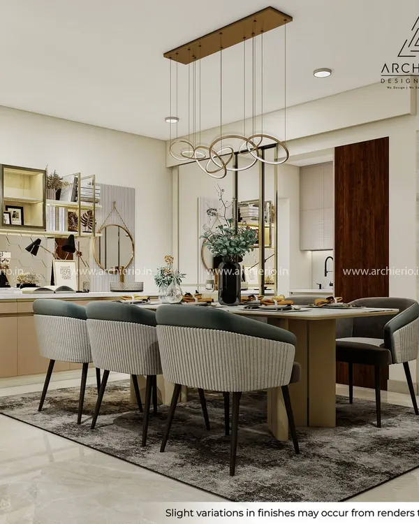 This dining area is a statement of refined living, where a modern chandelier and comfortable seating come together. The adjoining crockery unit adds both storage and a display element, blending seamlessly with the kitchen.