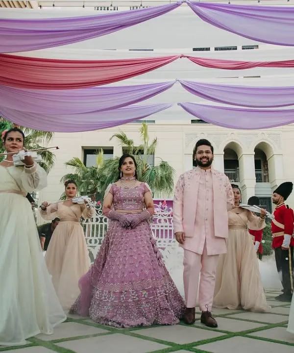 Stepping into the enchanting world of Bridgerton. For this Mehendi, I arranged for the couple to be escorted by violinists and royal guards, creating a grand, Regency-era entrance.