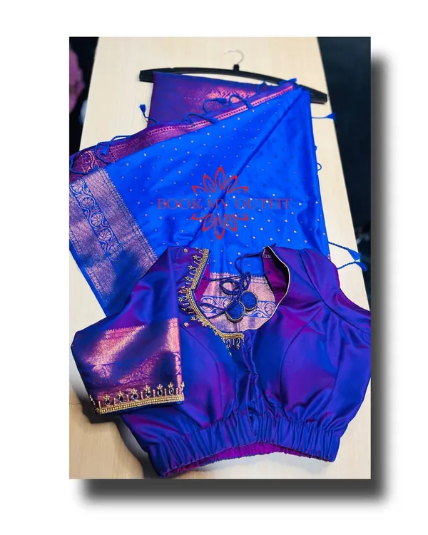 Here is the full look of the iridescent blue and purple silk saree paired with its custom-designed blouse. The unique back cutout and puff sleeves complement the traditional saree perfectly.