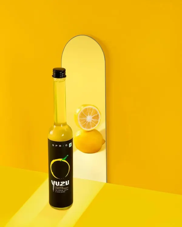 A creative and conceptual shot for Sprig's Yuzu Citrus Extract. I used a mirror and a strong monochromatic color scheme to create a visually arresting image that tells a story of flavor and freshness, perfect for brands looking to make a bold statement.