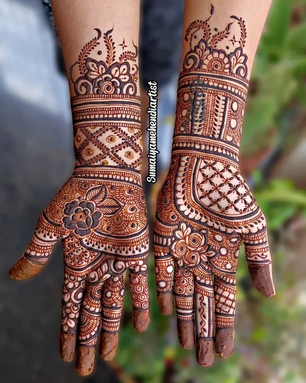 A gorgeous semi bridal design with a mix of floral and geometric patterns. This style provides beautiful coverage on the hands and wrists without extending all the way up the arm.