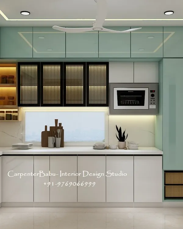 A sleek L-shaped kitchen with a two-tone color scheme. The mint green overhead cabinets add a fresh pop of color, while the backlit open shelves provide stylish and accessible storage for spices.