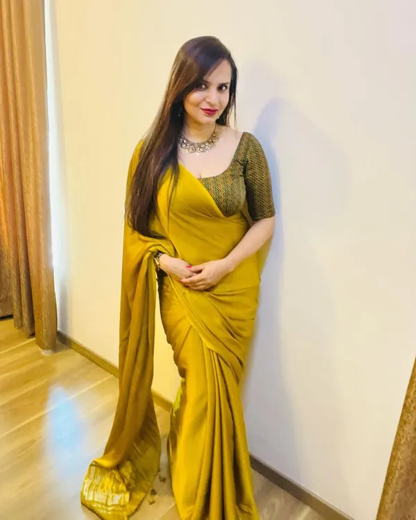 A full view of a custom saree I designed for Diwali. The rich mustard yellow fabric has a beautiful drape, and I paired it with a custom-fit blouse in a contrasting chevron print.