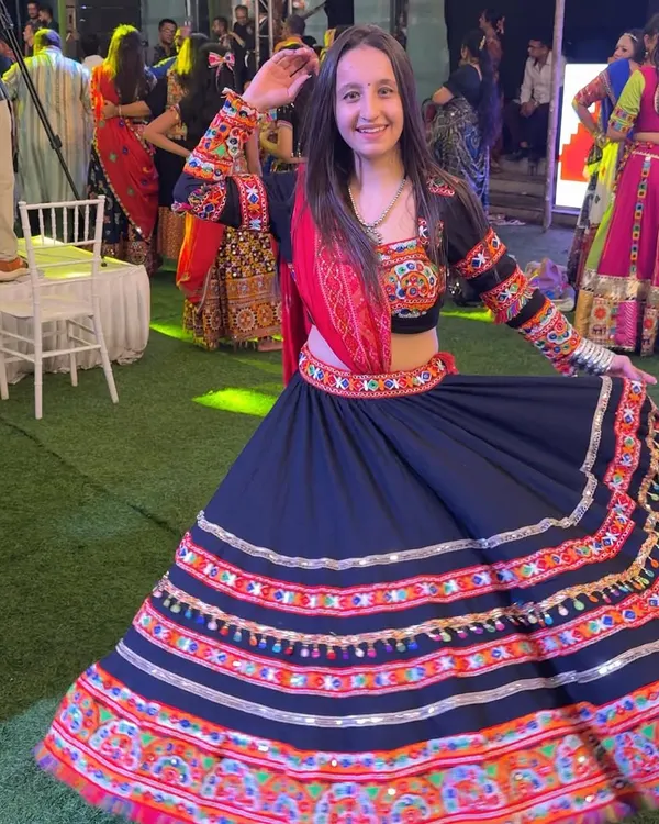 A full twirl in my beautiful black and red chaniya choli at a Navratri event. I love outfits that move with the dance, and this one was perfect for the occasion.
