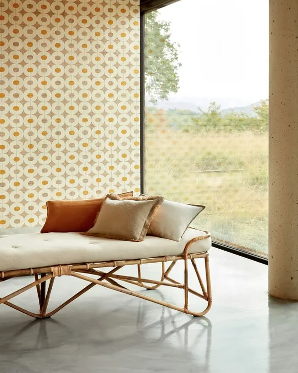 Channeling the essence of an urban oasis, this room features a geometric raffia wallcovering that complements the natural light and minimalist furniture. The design breathes texture, balance, and quiet sophistication into the space.