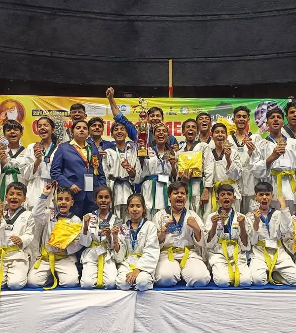 The joy of victory. Our team celebrates winning the Runner Up Team Trophy with 17 Gold, 9 Silver, and 4 Bronze medals at the Open National Taekwondo Championship.