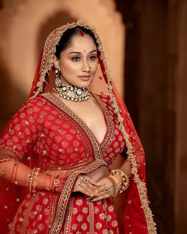 A beautiful bride wearing one of my signature Polki and Meenakari choker sets. This rental piece is perfect for adding a touch of tradition and colour to your wedding attire.