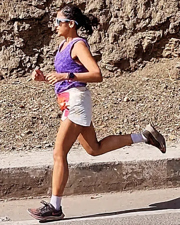 Distance teaches endurance, but hills teach grit. A powerful stride during a hill training session, building the strength needed to conquer any incline.