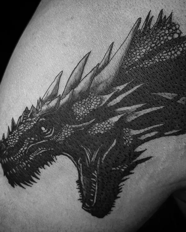 This black and grey tattoo of Balerion the dragon showcases my passion for detailed, high-contrast mythical creatures. I focus on capturing the power and texture in each piece, making it a bold statement.