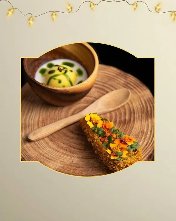A beautifully plated appetizer duo perfect for a Diwali celebration. The dish features a delicate sphere in a light sauce and a crispy, garnished roll, showcasing our attention to detail for festive dining.