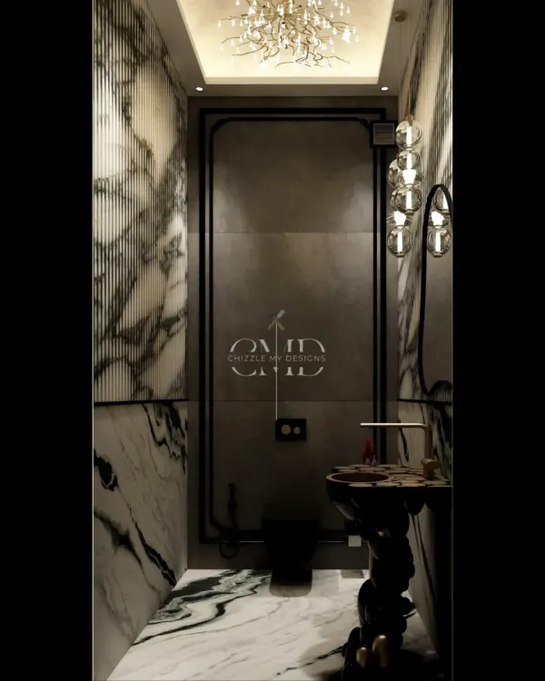 This powder room is a masterclass in drama and luxury. I used book-matched marble with striking veins, a sculptural pedestal sink, and a statement chandelier to create an unforgettable experience for guests in this Noida penthouse.